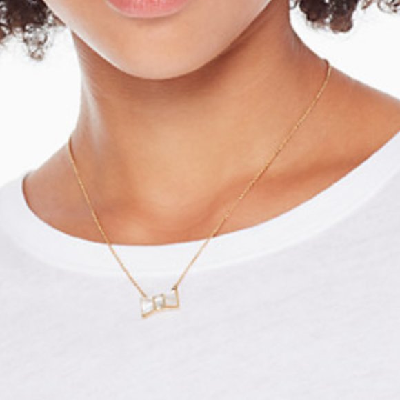 kate spade Jewelry - NWT KATE SPADE CREAM GOLD BOW NECKLACE
